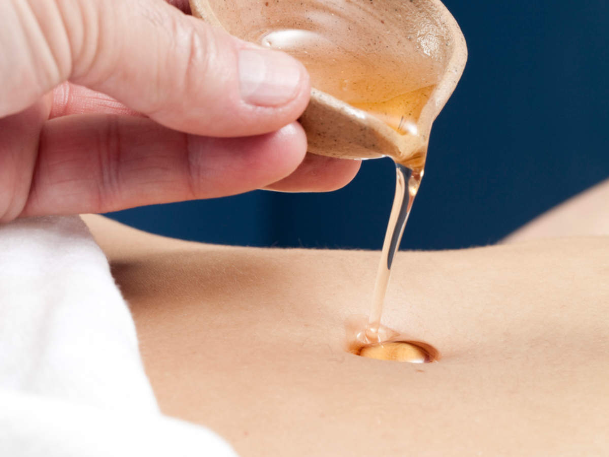 Massage the abdomen with essential oils