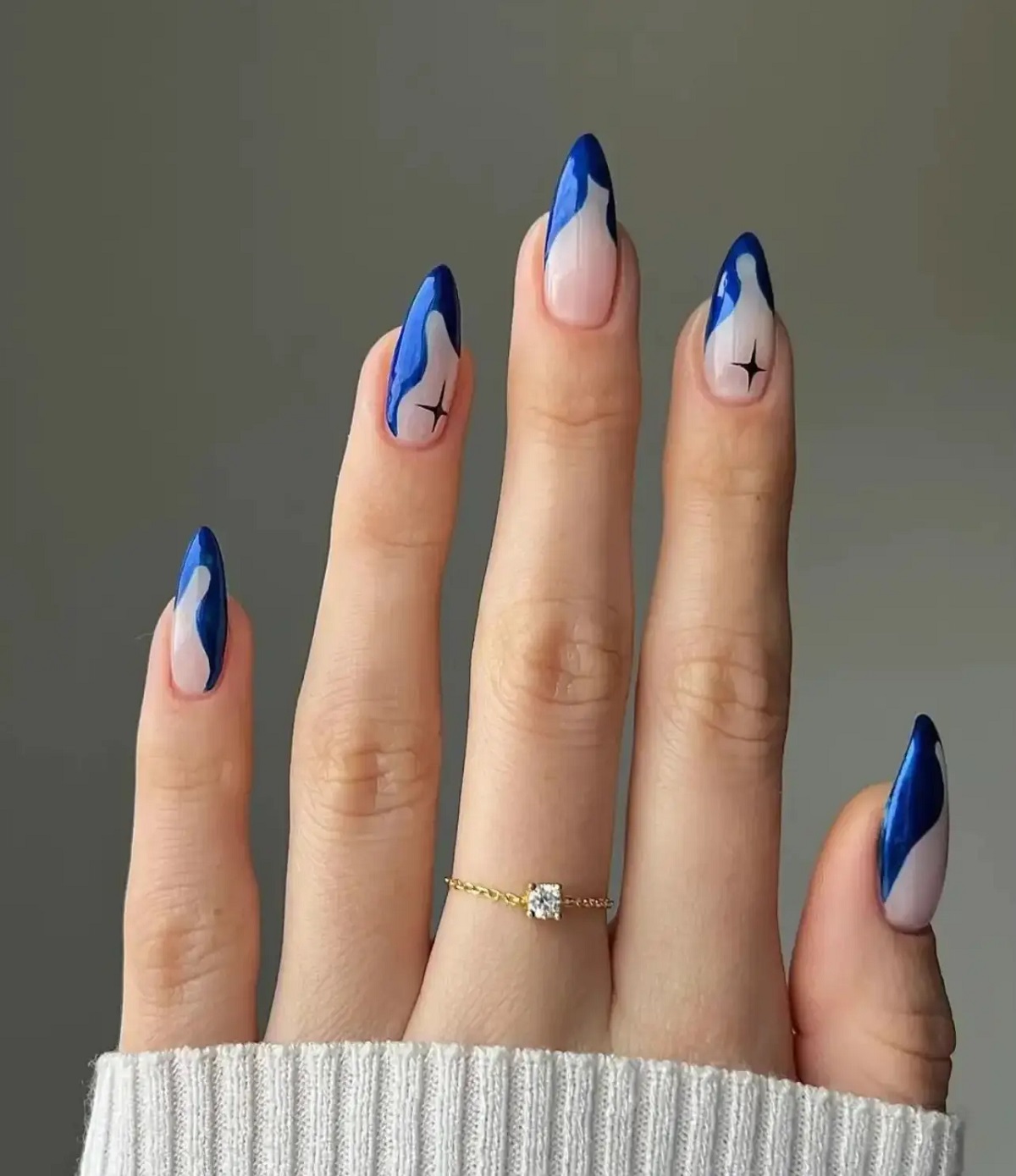 Whimsical Wavy Blue Winter Nail with Celestial Star Designs
